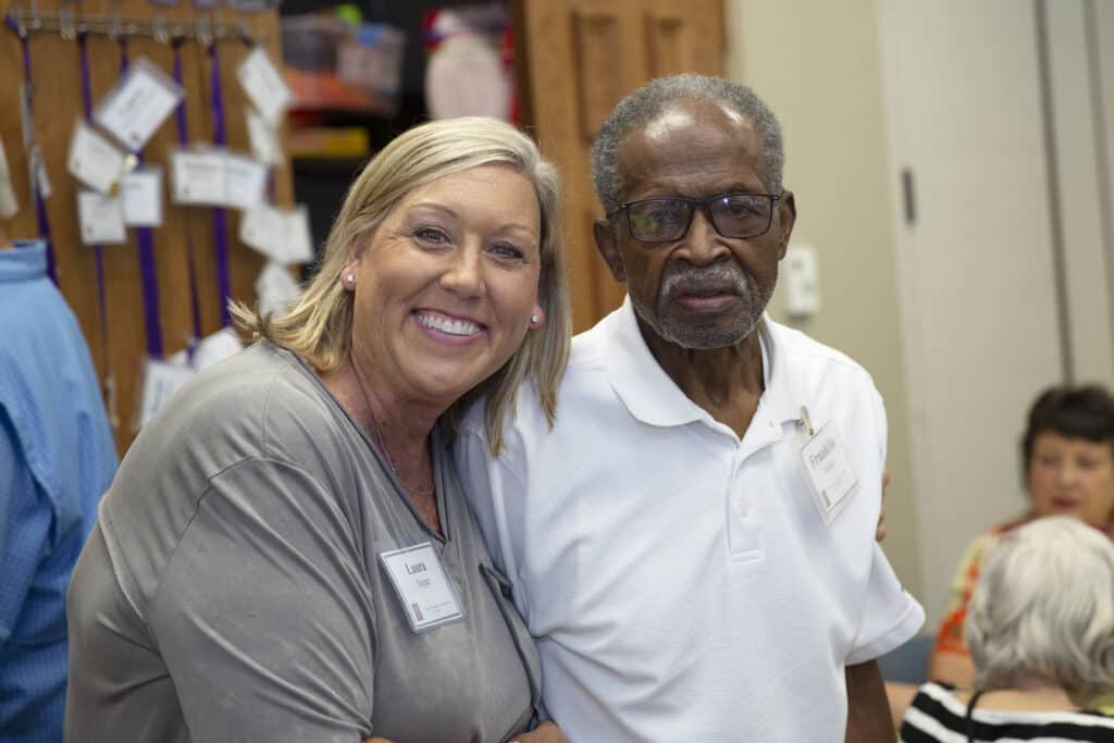 RFA Community Volunteer stands near a RFA Friend during a day of respite.